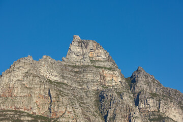 Scenic landscape of Table Mountain in Cape Town, South Africa against a clear blue sky background from below with copy space. Beautiful panoramic of an iconic landmark and famous travel destination