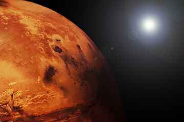 Planet Mars, on a dark background with the Sun. Elements of this image furnished by NASA