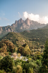 Fototapeta na wymiar Rocks above the sea near the town of Porto Ota on the island of Corsica in France.