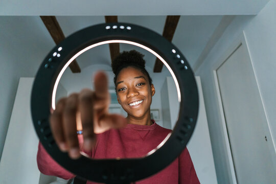 Friendly teen vlogger starting to shoot video