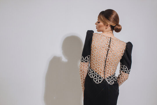 Young woman in dress with beautiful back 