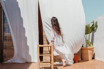 Brunette girl in white at terrace