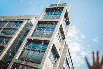 Sky confetti flying above during Pride parade