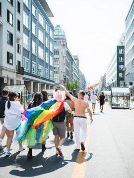 Friends walking on the street during Pride