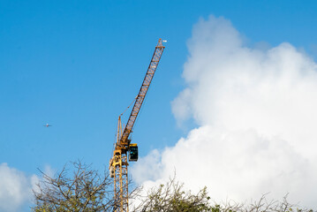 Lisbon, Portugal. April 10, 2022: Construction crane and blue sky in the city.