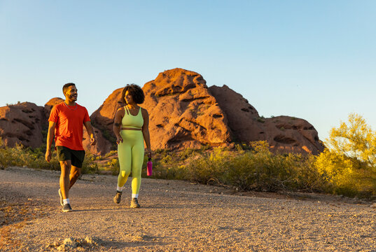  Gen Z Black Couple Hiking Laughing Together In Desert  