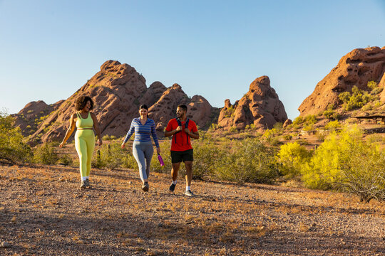 Group of Friends Hiking together in Arizona Desert arid landscape 