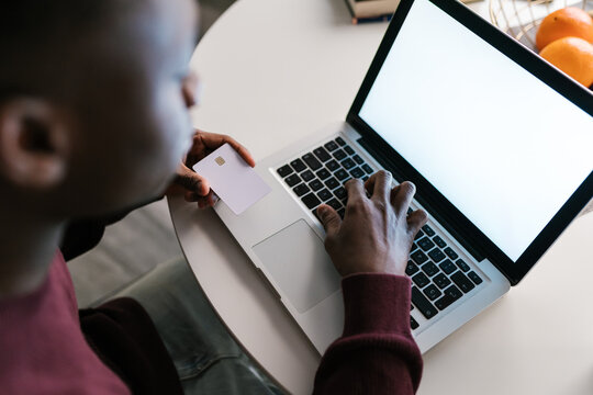 African American man making online purchases