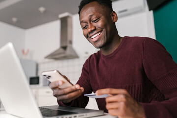 Glad black man browsing online store application