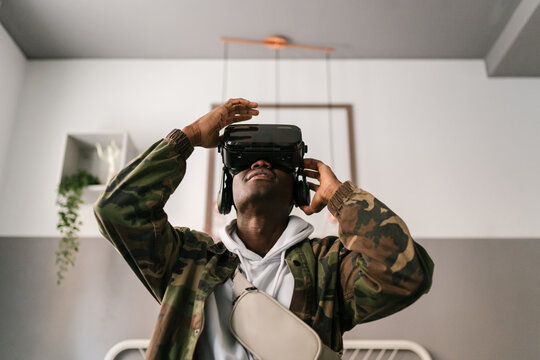 African American male looking up in virtual reality