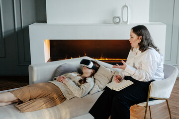 Patient lying near psychologist during mental health treatment