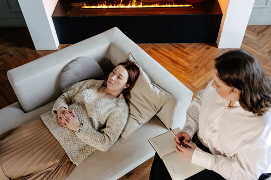 Psychologist talking with client during therapy