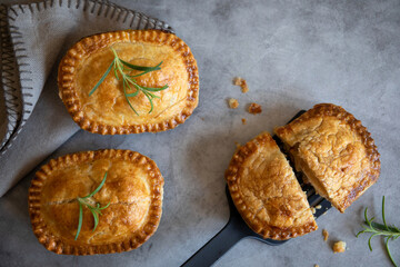 homemade mini meat pies, top view, grey background