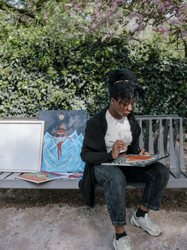 Black skin artist plein air making pictures