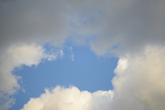 white peaceful sky, white cirrus clouds, beautiful sunny sky, blue sky, yellow lantern, minimalism, building, construction