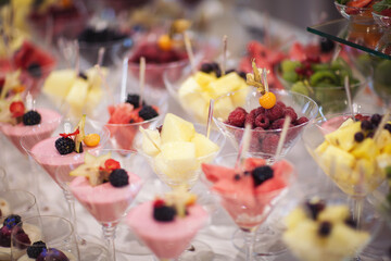 Catering on wedding. Wedding banquet table. Sweet table with fruit. Fruit bar on party. Delicious...