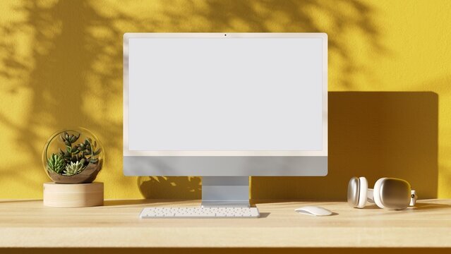 Computer with blank screen on wood table. Aesthetic workplace.  