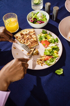 Woman eating quesadilla