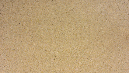 Fototapeta na wymiar Yellow sand texture background, empty space