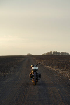 Motorcycle parked on road in nature