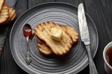 Continental Breakfast meal served with coffee, toast, jam and butter. Delicious coffee table.