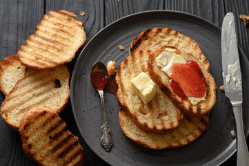 Continental Breakfast meal served with coffee, toast, jam and butter. Delicious coffee table.