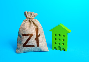 Polish zloty money bag and green Resident building. Investments in sustainable housing. Reduced...