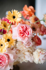 Delicate bouquet of wildflowers with roses, chrysanthemums, and gerberas.