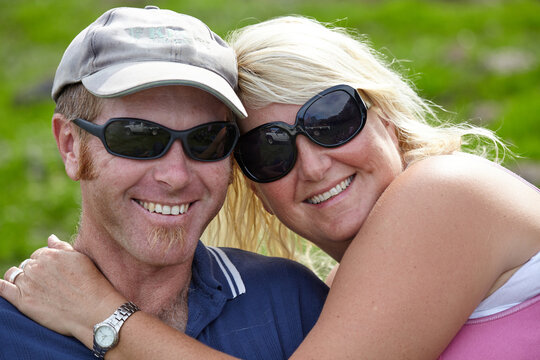 Happing farming couple embracing