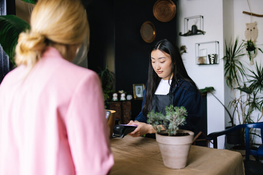 Employee inserting keys on contactless terminal 