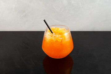Orange Granizado. Spanish Refreshing summer iced drink. Slushie drink. Sweet Shaved ice with...