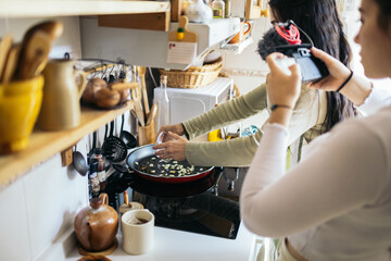 Mother and daughter creating content for a cooking vlog