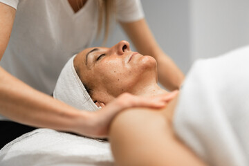 woman receiving facial massage