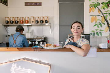 Content barista woman at snack bar