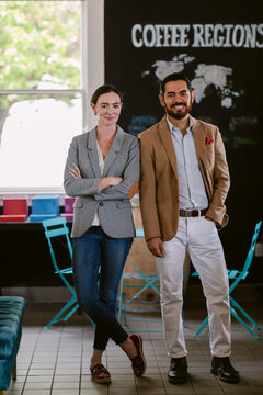 Coffee shop partners posing to camera