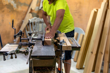 master carpenter preparing the wood in his workshop to work