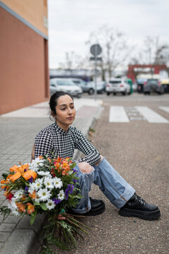 young woman with bouquet of flowers