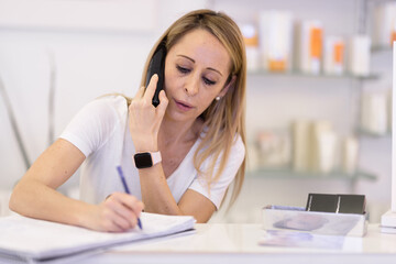 Business lady takes a call from clients