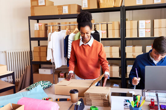 Happy multiracial colleagues working in warehouse