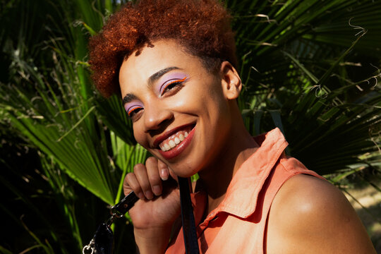 Portrait of nice and happy girl in a garden. Close up