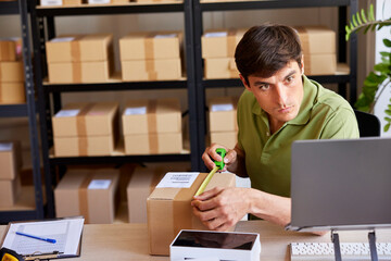 Post office worker measuring box