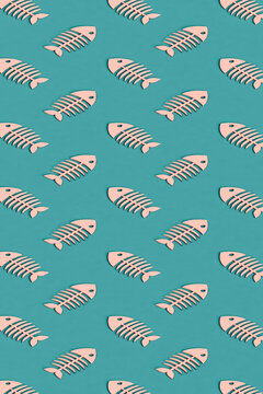 vertical pattern of many pink cartoonish fishbones