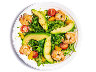 Vegetable salad with arugula, avocado, tomatoes and shrimps. Healthy and vegan food.