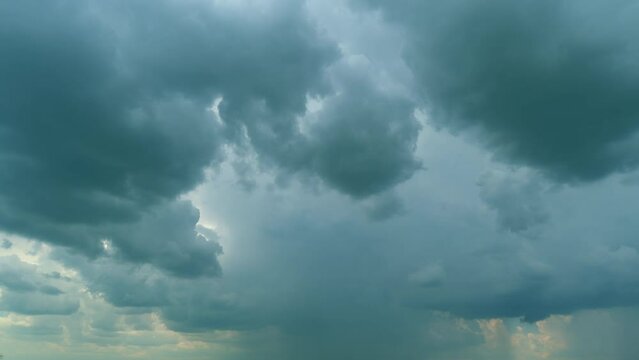 Time lapse. Cumulus clouds moves in the blue sky. Extreme weather before rain.