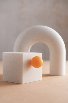 3D Printed White Cube With Arc And Small Orange Ball