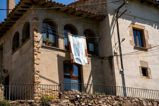 Old stone village house with blanket drying on the sun