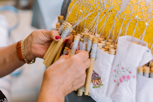 Hands of an elder woman doing crafts