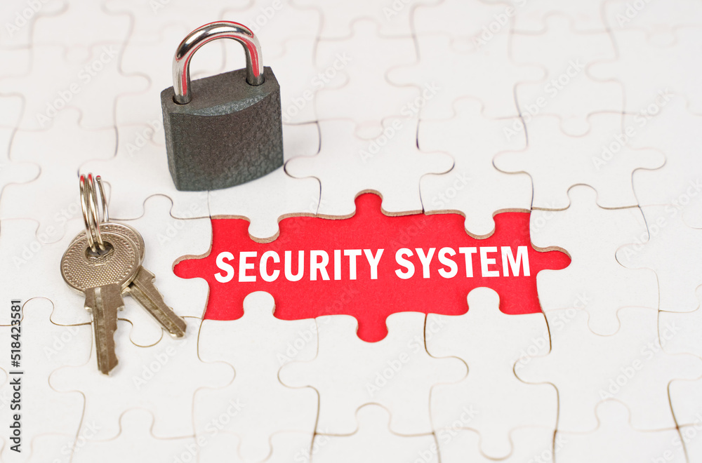Aufkleber on puzzles there is a lock and keys, on a red surface there is an inscription - security system
