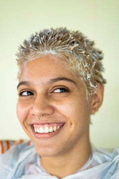 Woman having her hair bleached 
