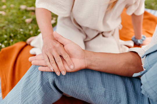 Anonymous couple holding hands